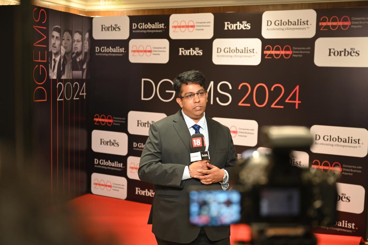 HyperNext leadership interviewed against the Forbes India Select 200 backdrop at the DGEMS 2024 Summit